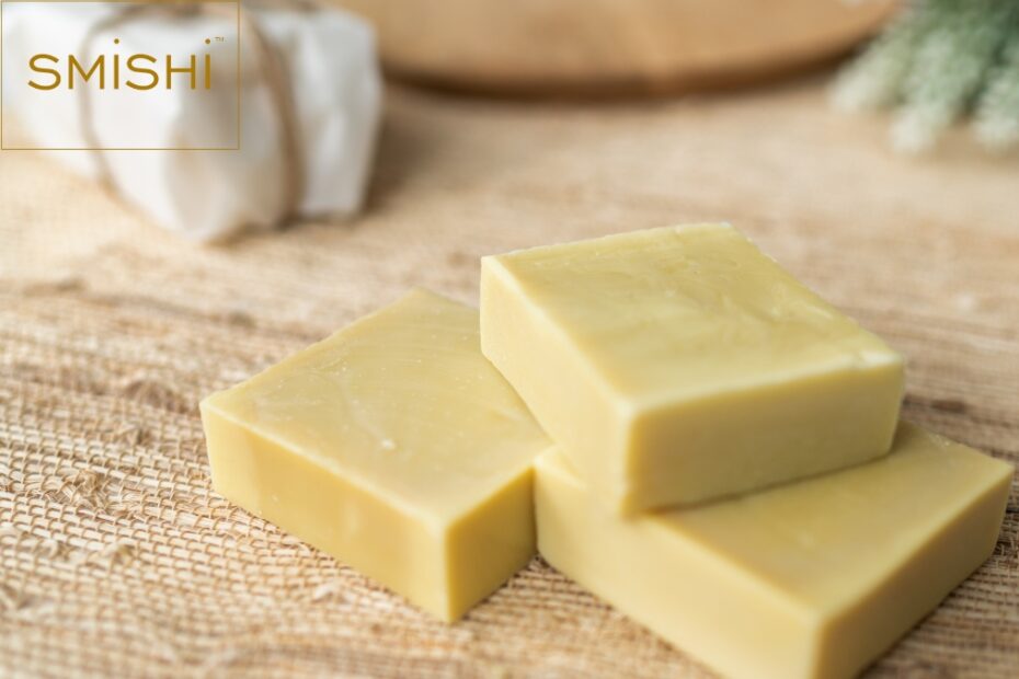 A stack of Smishi handcrafted olive oil soap bars, showcasing their natural texture and luxurious design, made with pure extra virgin olive oil.